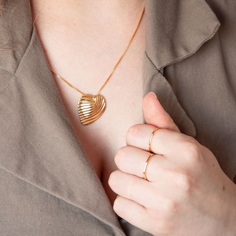 Anel aparador com 6 zircônias regulável folheado a ouro 18k