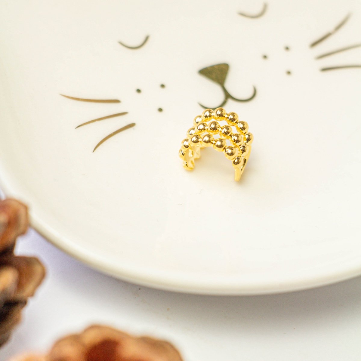 Piercing fake 3 linhas com bolinhas folheado a ouro 18k