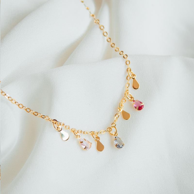 Pulseira de zircônias ovais coloridas folheada a ouro 18k