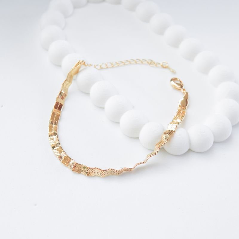 Pulseira rígida ondulada folheada a ouro 18k